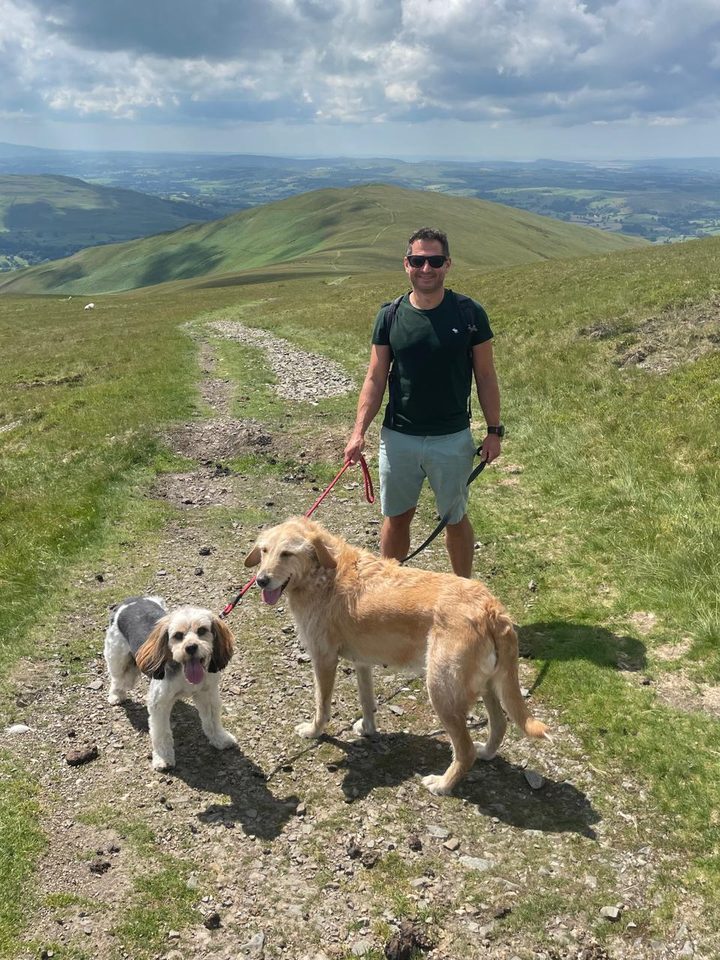 Andrew Baggaley with his two dogs on a fell walk